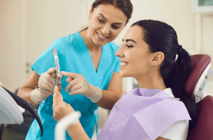 orthodontic patient looking at smile in mirror